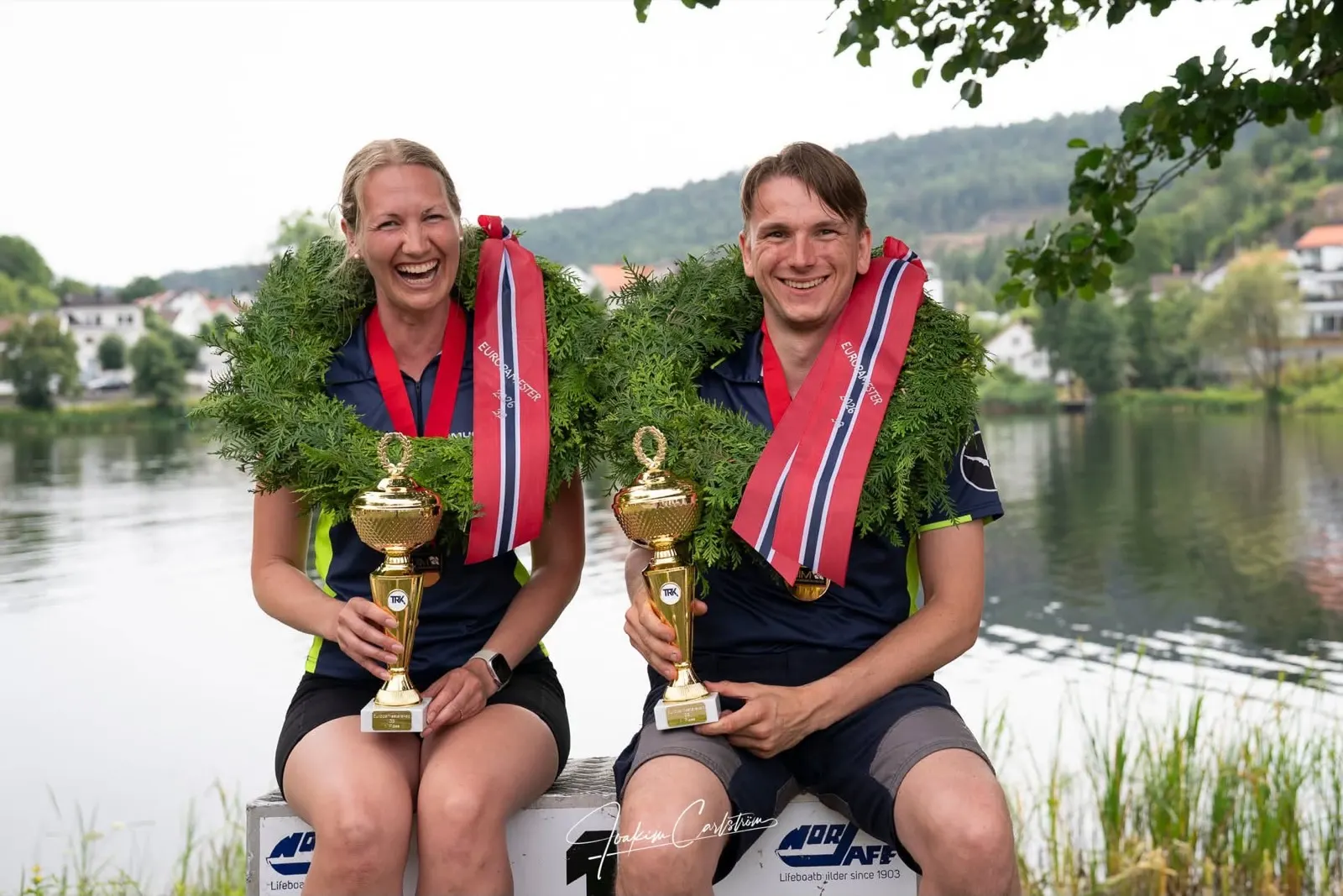 Madeleine Samuelsson and Rasmus Hamrén with trophies and laurel wreaths as 2026 European champions